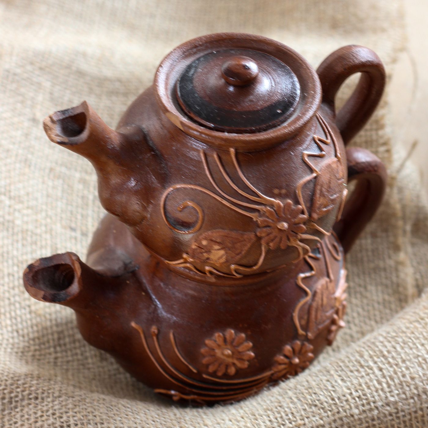 A decorated clay double tea pot, built as one pot stacked on another in the traditional way.